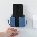 One Pcs Mobile Phone Charging Hanging Holder Multifunction Wall Mounted Plug Bracket Remote Control Mounted Storage Box. 