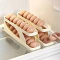 1 pcs Egg Dispenser - Food Grade Plastic, White, Made in China, 14-15 Egg Capacity, Rolling and Automatic Sliding Spiral Holder, Ideal for Refrigerator Storage.