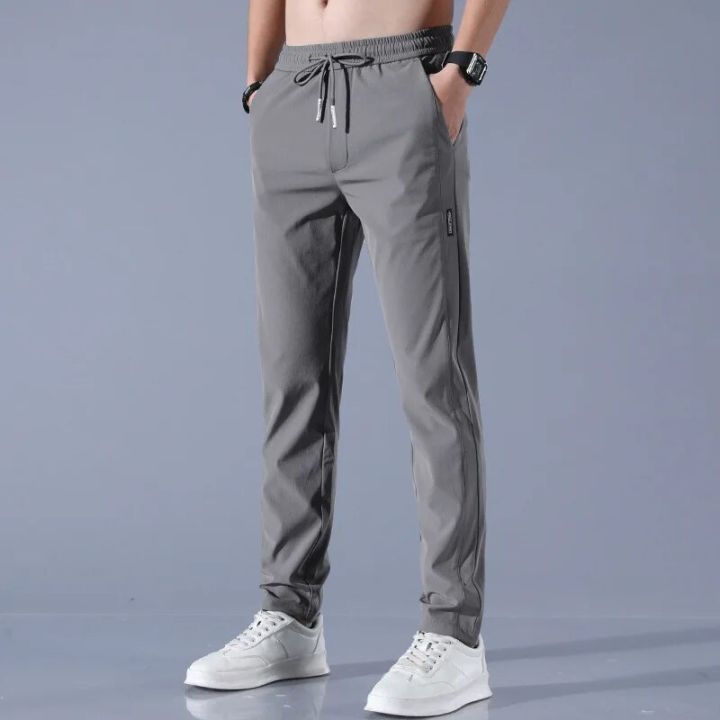 New%20Men's%20Ice%20Silk%20Trousers%20Solid%20Color%20Mid-Waist%20Loose%20Breathable%20Straight%20Casual%20Pants%20Thin%20Quick-Drying%20Drawstring%20Sweatpants%20-%20Image%203