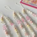 Creative sense of small fresh girly color matching cute bear DIY beaded mobile phone chain, mobile phone case accessories, mobile phone accessories.