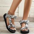 Foreign trade plus size beach shoes women's 2022 new European and American velcro bow round toe flat leopard print sandals women.
