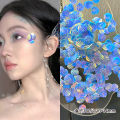 Face jewelry, antique shark makeup, shell fish scales, mermaid tear makeup, Hanfu, pearl nail art, eye makeup, patches. 