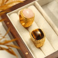 European and American new cross-border light luxury retro titanium steel plated 18K gold natural tiger's eye powder stone ring jewelry wholesale.