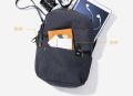 Compact Mi Shoulder Bag - Mini Backpack for Men and Women - Black Sports and Travel Companion.