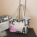 Simple Versatile Canvas Handbag Personalized Letter Printed Shoulder Bag Fashionable Large Capacity Commuter Tote Bag. 