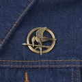 Cross-border hot Hunger games Mockingjay pin pins in stock. 