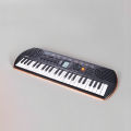 Casio SA-77 Portable Musical Keyboard Piano - Black & Grey with adapter. 