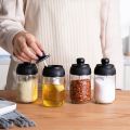 Kitchen Seasoning Bottle Set Household Sealed Moisture Proof Spoon Cover Integrated Glass Seasoning Jar.