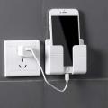 Universal wall charger hook mobile phone holder adhesive remote control stand wall phone mount charging stand.