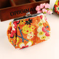 Large capacity embroidered fabric coin purse ladies hand holding small makeup bag mouth gold bag material bag finished product wholesale. 
