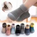 Baby walking shoes in autumn winter with plush thickened soft soles, non slip, pure cotton floor socks for both boys and girls to keep warm.