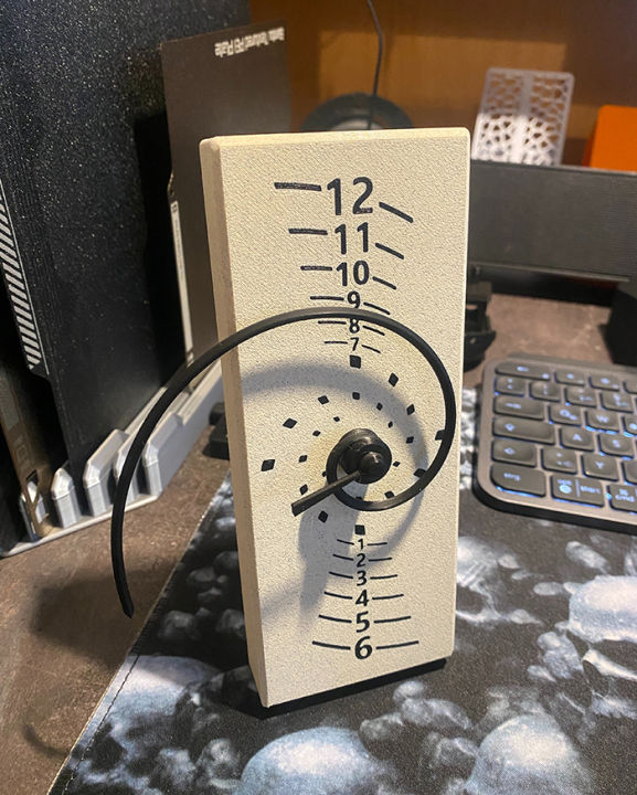 3D%20Printed%20Fibonacci%20Golden%20Spiral%20Clock%20-%20Unique%20Mathematical%20Timepiece%20with%20Ironed%20Marble%20Finish%20and%20Versatile%20Desk/Wall%20Mounting%20-%20Image%206