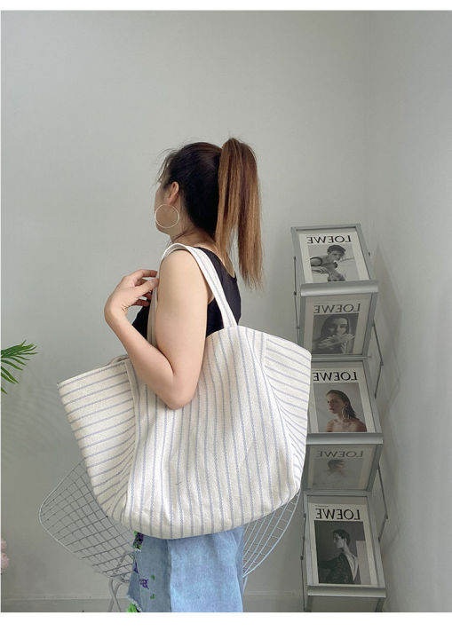 Canvas%20bag%20women's%20ins%20one-shoulder,%20large-capacity,%20lazy%20wind,%20striped%20fashion,%20big%20bag,%20casual%20literary%20hand-tote%20bag%20women%20-%20Image%206