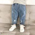 Children's Ripped Jeans Spring and Autumn New 1-8 Girls and Boys Years Old Loose Trousers Baby Western Style Daddy Pants. 