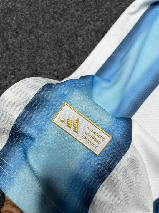 Argentina%20Baby%20Jersey%202026%20World%20Cup%20%E2%80%93%20Kids%20Football%20Jersey%20Set%20%E2%80%93%20Premium%203-Star%20National%20Team%20Kit%20Half%20Sleeve%20Argentina%20Home%20Kit%20premium%20sticker%20print%20-%20Image%205