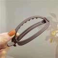 Korean version oval large straight buckle with a headband at back of the head pure color simple twist hair clip. 