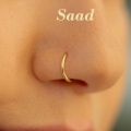 Golden Noth Type Nose Pin For Women And fashionable Girls Simple . Nose Ring , Wedding,Fashion,Partywear. Model:PE1.. 