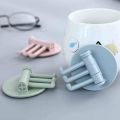 Multifunctional bathroom wall shelf free punching seamless trace rack rotating hook strong 3 branch rotating sticky hook.