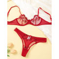 Standard quality flower transparent bra panty set.