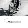 Bicycle Tubeless Sealant Injector and Presta Valve Core Removal Tool.
