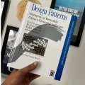 Design Patterns: Elements of Reusable Object-Oriented Software  by Erich Gamma , Richard Helm , Ralph Johnson , John Vlissides , Grady Booch (Foreword) , First Edition. 