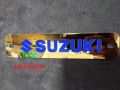 Suzuk-i gixxer metal front name plate golden colour. 