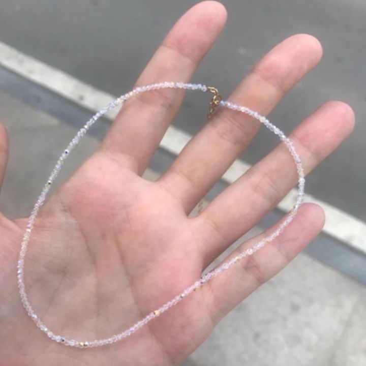 Each%20piece%20has%2032%20facets%20of%20the%20handmade%20piece,%20each%20with%20a%20sunshine%2014K%20gold-injected%20crystal%20choker%20collar%20with%20an%20extremely%20thin%20necklace%20-%20Image%202