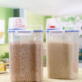 2L Rice Storage Container with Measuring Cup Transparent Sealed Food Storage Containers for Grain Cereal Soybean Snack Pet Food in Kitchen Pantry Fridge.