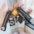 LED Luminous Sound Daisy Camera Pendant Keychain - Creative and Fun. 