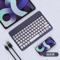 The new bluetooth keyboard round keycaps are suitable for Apple Huawei phablet color frame wireless keyboard cross-border wholesale. 