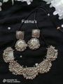 Women fashionable antique silver necklace set with earrings. 