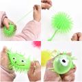 Smile Face Puffer Ball with Flashing Light Stress Relief Squeeze Ball Fun Toy for Children and Adults (Random Color) Pack of 1.