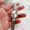 Women Quartz Watch Luxury Oval Shaped Fashion Mini Case Small Roman Numeral Dial Female Full Metal Band Watches Niche Wristwatch.
