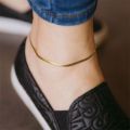 European and American style blade anklet made of titanium steel, non-fading, hypoallergenic, 18K real gold plated flat snake chain. 