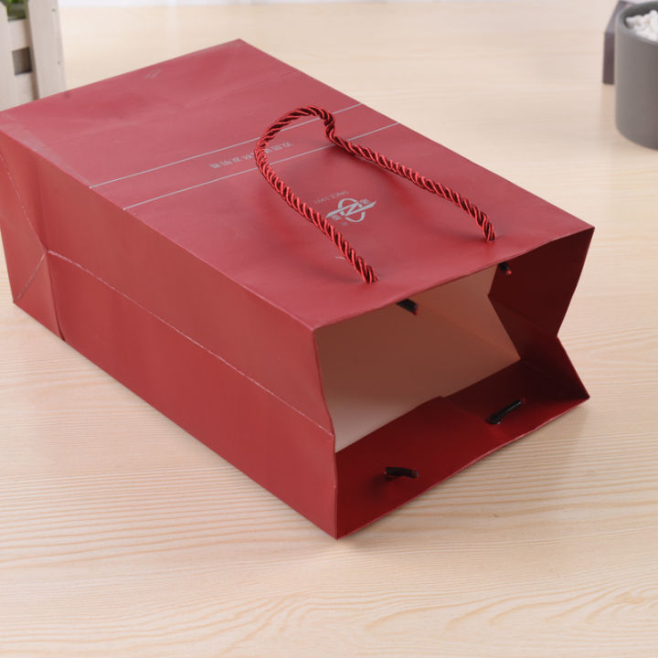 Portable%20paper%20bag%20custom%20white%20cardboard%20handbag%20gift%20paper%20bag%20custom%20advertising%20clothing%20shopping%20bag%20printing%20UV%20top%20system%20-%20Image%202