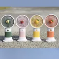 Convenient and ultra-quiet USB mini handheld wind power fan with portable phone holder student office small cooling fans. 