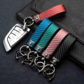 Automotive carbon fiber pattern fashion long metal key chain automotive leather key chain spring ring horseshoe buckle. 