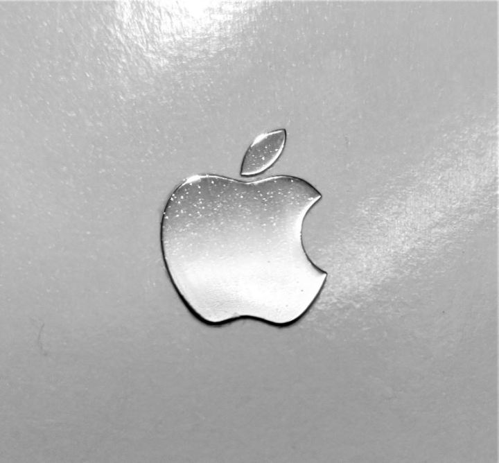 Innovative%20Appliance%20-%20Apple's%20metal%20look%20for%20iPhone%20mobile%20phone%20is%20a%20silver%20-colored%20logo%20sticker.%20-%20Image%202