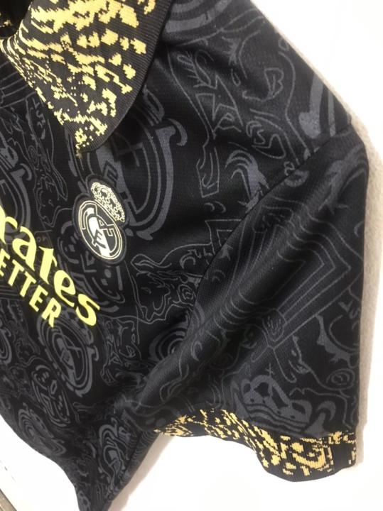 Real%20Madrid%20(With%20Embroidery)%20Premium%20Football%20Jersey%20Black%202023/24%20-%20Golden%20-%20Full%20Sleeve%20-%20Image%205