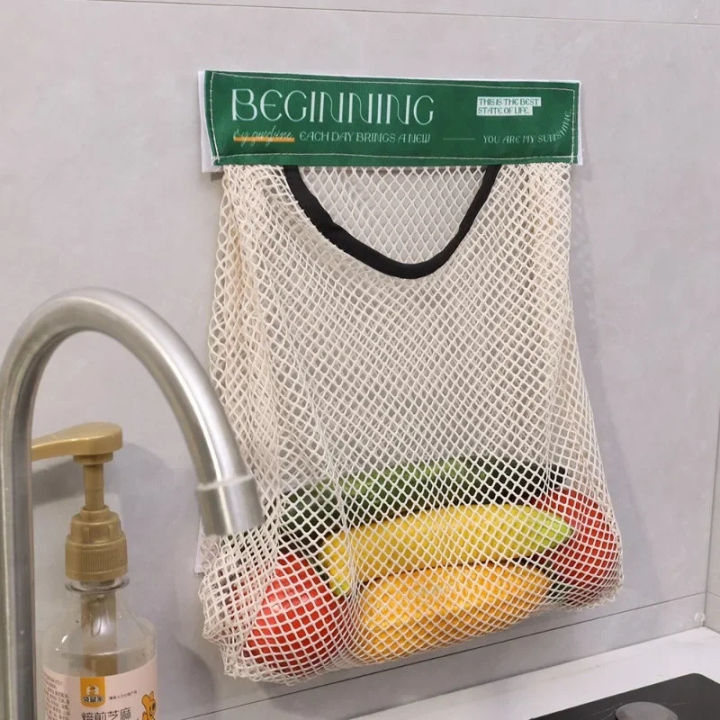 Elastic%20Mesh%20Storage%20Bag%20-%20For%20Kitchen%20Storage%20Fruits,%20Vegetables,%20Trash%20bag,%20Miscellaneous%20-%20Reusable%20,Free%20Wall%20Mounted,%20Self-Adhesive%20-%20Hanging%20Storage%20Mesh%20Bags%20-%20Image%204