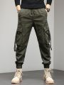 Outdoor Cargo Pants Men Cotton Relaxed Fit Tactical Military Pants Multi Pockets Hiking Trousers Drawstring Army Green Joggers. 