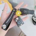 LED Luminous Sound Daisy Camera Pendant Keychain - Creative and Fun. 