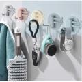 Multifunctional bathroom wall shelf free punching seamless trace rack rotating hook strong 3 branch rotating sticky hook.