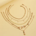 European and American stacking style fashion imitation pearl set anklets beach style star tassel pineapple pendant anklets 5 pieces. 