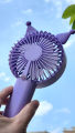 Handheld and Travel-friendly USB Rechargeable Mini Fan with Popular Cartoon Shape.