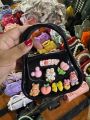 Cute Kids Handbag for Girls – Black Cartoon Charm Purse with Rainbow, Bow & Bear Accessories – Stylish Mini Shoulder Bag. 