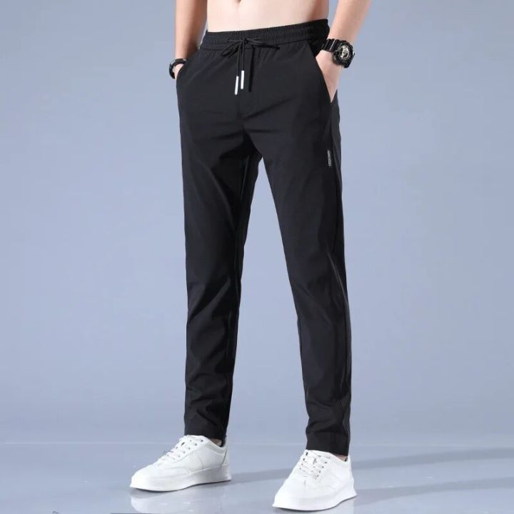 New%20Men's%20Ice%20Silk%20Trousers%20Solid%20Color%20Mid-Waist%20Loose%20Breathable%20Straight%20Casual%20Pants%20Thin%20Quick-Drying%20Drawstring%20Sweatpants%20-%20Image%202