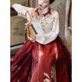 New Chinese style Hanfu heavy industry embroidery, cloud shoulder standing collar shirt, paired with woven gold horse face skirt, wedding engagement dress. 