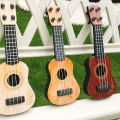 【happy one】Mini Guitar Strings Classical Ukulele Guitar Instruments for Kids Children Beginners Early Education Small Guitar. 