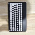 The new bluetooth keyboard round keycaps are suitable for Apple Huawei phablet color frame wireless keyboard cross-border wholesale. 